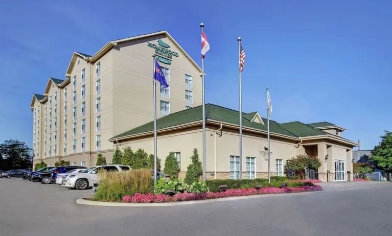 Hotel exterior and parking area at Homewood Suites By Hilton Burlington.