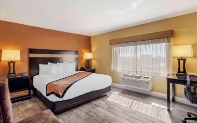 Day use room with sofa and work desk at Best Western Plus Newark Airport West.