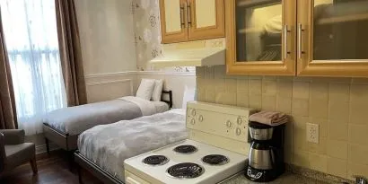 Twin room with in-room kitchen at Parc Suites Hotel.