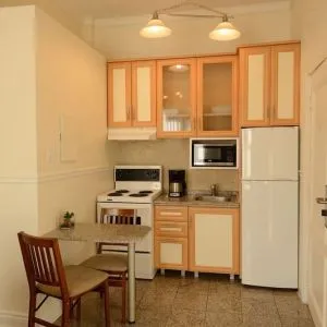 Day use room with private bathroom and in-room kitchen at Parc Suites Hotel.