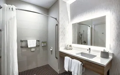 Day use guest bathroom with shower and toiletries at Holiday Inn Express & Suites Airport-Calgary.