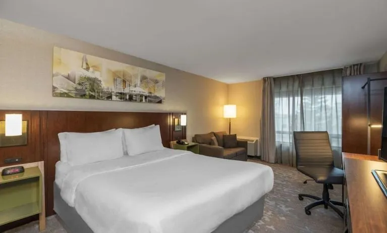 Day use room with work desk and sofa at Comfort Inn Sudbury East.