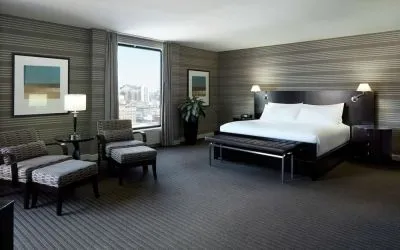 Day use room with work desk, lounge area and private bathroom at DoubleTree By Hilton Montreal.