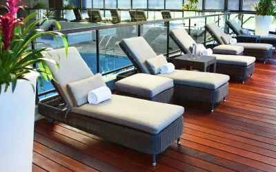 Relaxing indoor pool with lounge chairs at DoubleTree By Hilton Montreal.