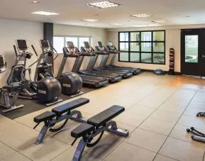 Fully equipped fitness center at Hilton Winnipeg Airport Suites.