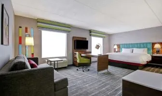 Day use studio suite with work station, lounge area and lounge area at the  Hampton Inn & Suites By Hilton Guelph.