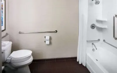 Guest bathroom with shower and tub at Hilton Albany.
