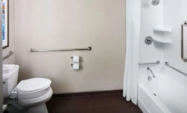 Guest bathroom with shower and tub at Hilton Albany.
