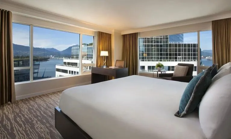 Day use room with work desk, sofa and private bathrom at the Fairmont Waterfront.