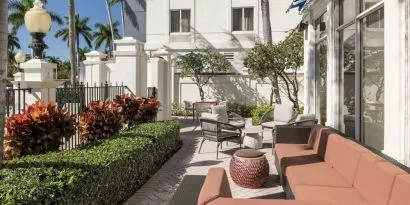 Outdoor seats available at Hilton Garden Inn Boca Raton.
