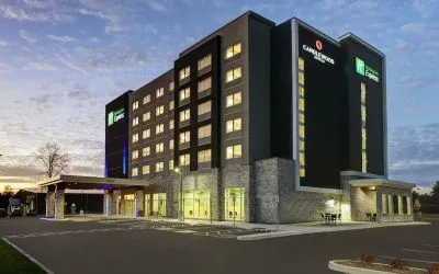 Hotel exterior and parking area at Holiday Inn Express Kingston West.