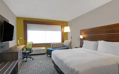 Day use room with TV, sofa, work desk and private bathroom at Holiday Inn Express Kingston West.