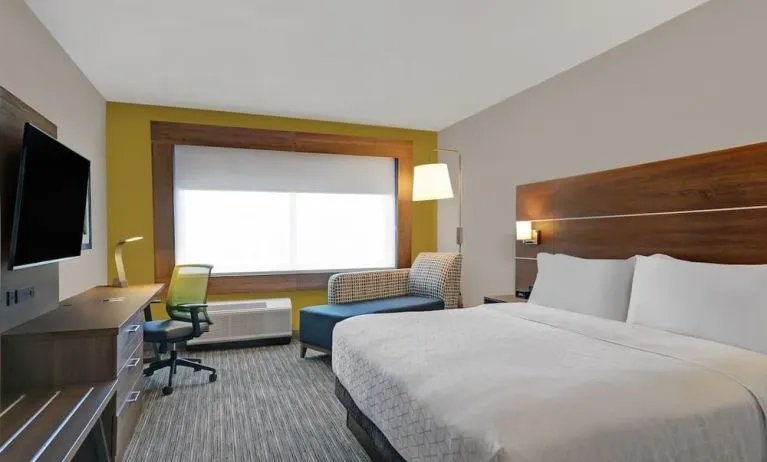 Day use room with TV, sofa, work desk and private bathroom at Holiday Inn Express Kingston West.