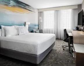 Day use room with TV, work desk and private bathroom at Courtyard By Marriott Edmonton Downtown.