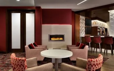 Hotel bar comfortable lounge area with fireplace at DoubleTree By Hilton Hotel Toronto Airport West.
