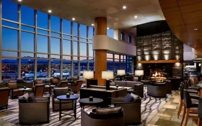 Hotel bar lounge area with fireplace at Fairmont Vancouver Airport - YVR Terminal Hotel.