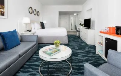 Day use room with sofa and work desk at YVE Hotel Miami.