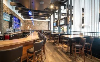 Hotel bar with lounge seating at Acclaim Hotel Calgary Airport.