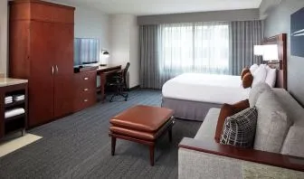 Day use room with sofa and work desk at Courtyard By Marriott Los Angeles LAX/Century Boulevard.