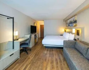 Day use room with TV, sofa, work desk and private bathroom at Comfort Inn Corner Brook.
