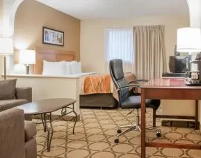 Day use suite with work desk and living area at Comfort Inn Winnipeg II South.
