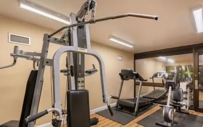 Fitness center at Coratel Plus Suites Wichita West Airport.