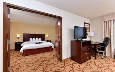 Day use room with living area and work desk at Hampton Inn Deer Park.