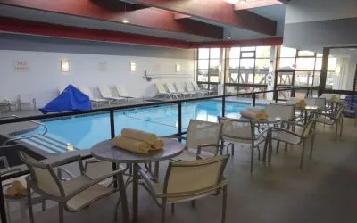 Tables and chairs available beside pool at DoubleTree By Hilton Westborough.