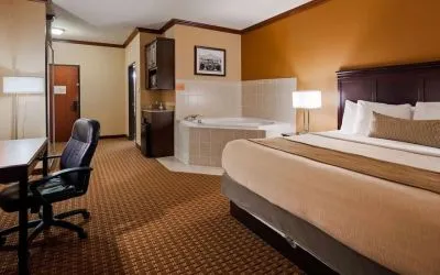 Day use room with bath tub and work desk at Best Western Granbury Inn & Suites.