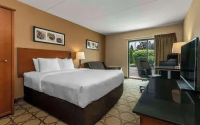 Standard day use room with TV, work desk, sofa and private bathroom at Comfort Inn New Glasgow.