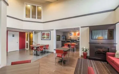 Lobby lounge with fireplace and comfortable sitting at Comfort Inn New Glasgow.