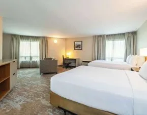Bright and spacious day use twin room with work desk at Comfort Inn Kingston HWY 401. 