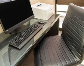 Business center with computer, printer and ergonomic chair at Comfort Inn Ottawa West.
