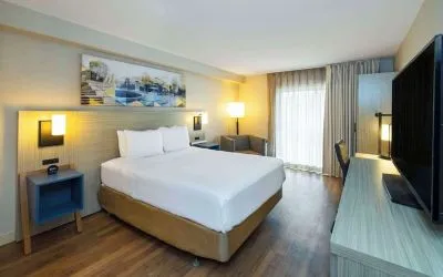 Standard day use room with TV, work desk, sofa and private bathroom at Comfort Inn Amherst.

