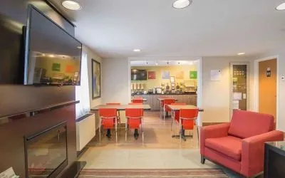 Lobby lounge with fireplace at Comfort Inn Amherst.
