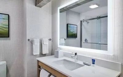 Guest bathroom with shower at Four Points By Sheraton Salt Lake City Airport.