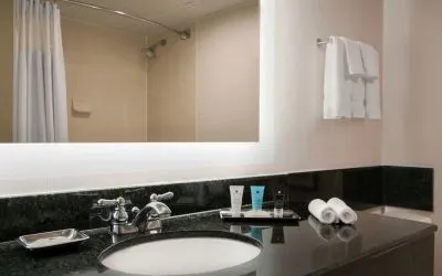 Guest bathroom with shower at Crowne Plaza Englewood.