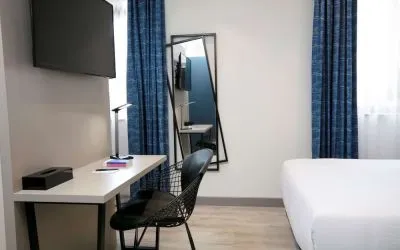 Day room with work station at Spark By Hilton Luton.