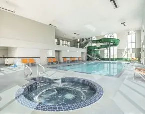 Indoor pool, jacuzzi and water slide at Holiday Inn Express & Suites Medicine Hat.