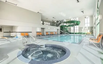 Indoor pool, jacuzzi and water slide at Holiday Inn Express & Suites Medicine Hat.