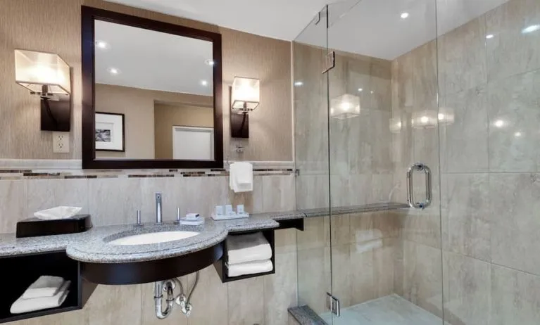 Guest bathroom with shower at Holiday Inn Peterborough-Waterfront.
