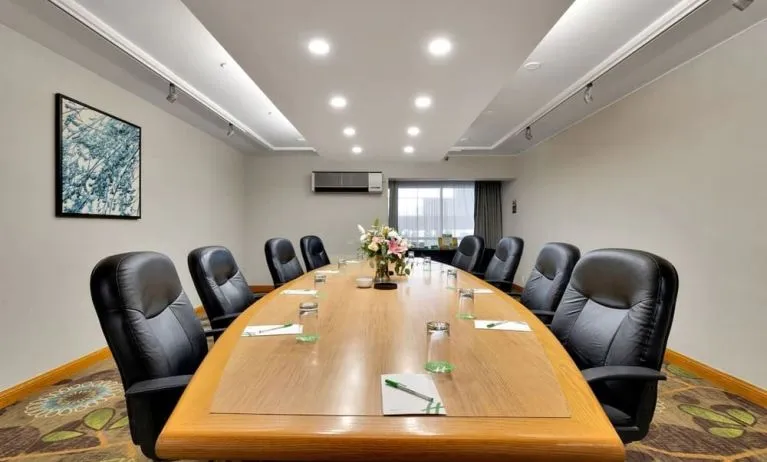 Professional meeting room with ergonomic chairs at Holiday Inn Peterborough-Waterfront.