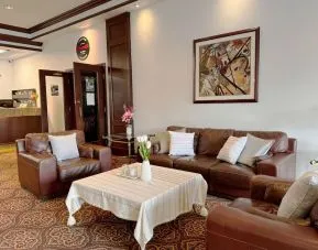 Comfortable lobby lounge at Divya Sutra Plaza & Conference Centre.
