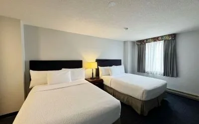 Bright and spacious day use twin room at Divya Sutra Plaza & Conference Centre.