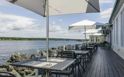 Terrace sitting area with beautiful view at Rodd Miramichi River.