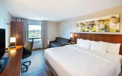 Standard day use room with TV, work desk, sofa and private bathroom at Comfort Inn Charlottetown.