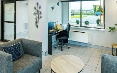 Hotel lobby workspace with computer, printer and ergonomic chair at Comfort Inn Charlottetown.