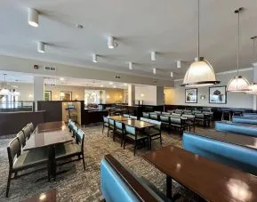 Dining area with comfortable seating at Holiday Inn Toronto Airport East.