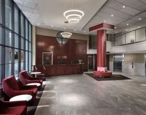 Lobby lounge with comfortable seating at Les Suites Hotel Ottawa.