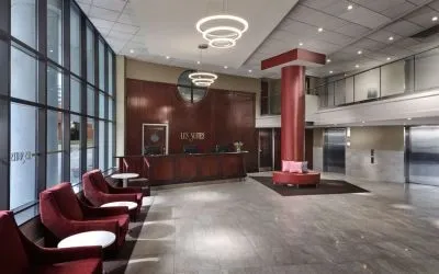 Lobby lounge with comfortable seating at Les Suites Hotel Ottawa.
